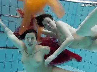 two hotties submersed underwater